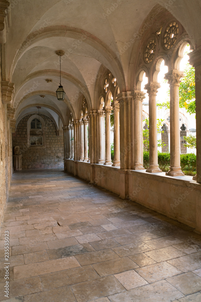Cloister with beautiful arches and columns in old Dominican monastery in Dubrovnik