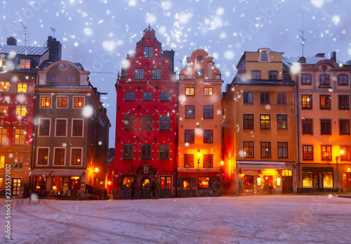 Gamla Stan ols square at winter night with snow, Stockholm, Sweden