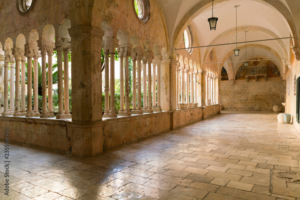 The decorative columns and arches of the corridors of the 13th Century Franciscan Monastery in Dubrovnik.