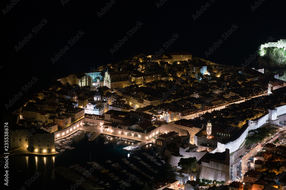 Aerial view of Dubrovnik city by night.