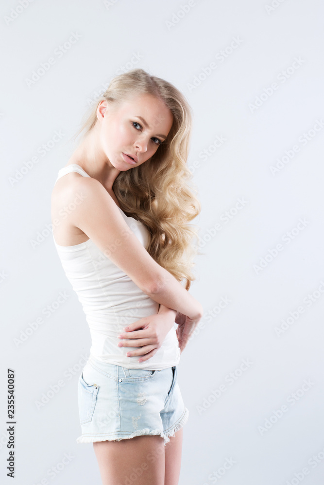 Portrait of beautiful blonde luxuriant hair curling. Portrait of beautiful blonde luxuriant hair curling.