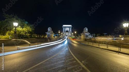 Night Time Lapse scene of the famous Chain bridge in Budapest with traffic. 4K resolution footage with long exposure.  photo