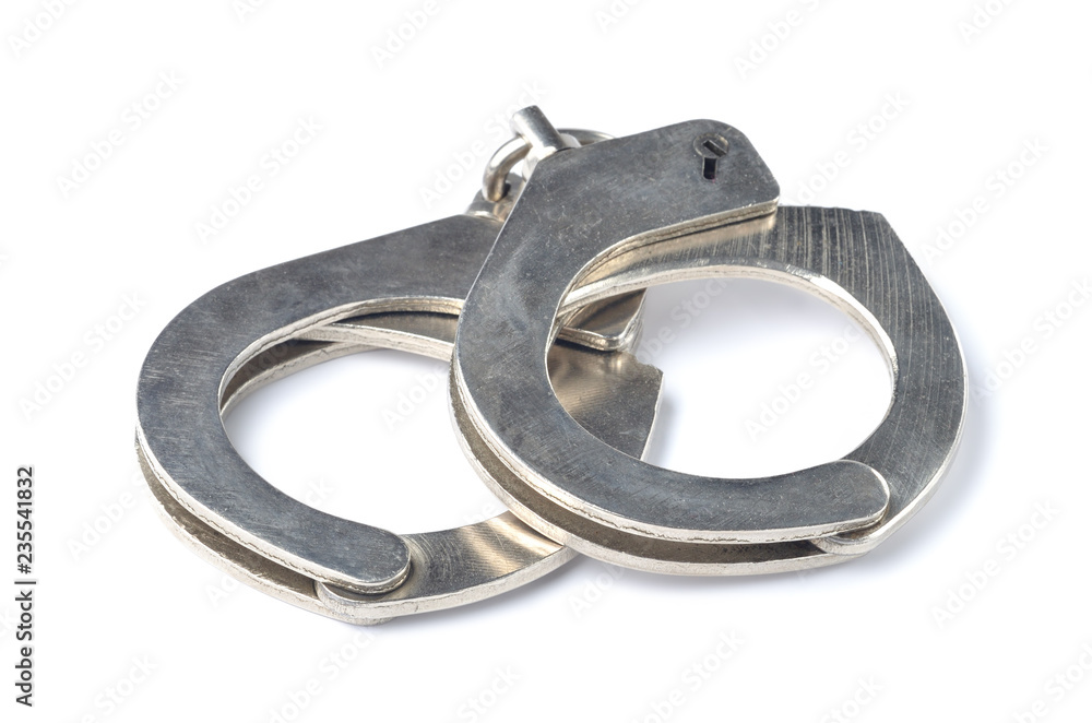 Metal police handcuffs isolated on white background Metal police handcuffs isolated on white background