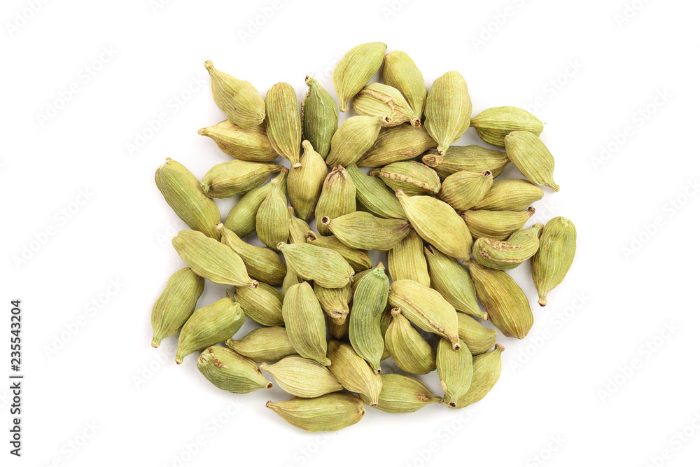 Green cardamom seeds isolated on white background. Top view. Flat lay Green cardamom seeds isolated on white background. Top view. Flat lay