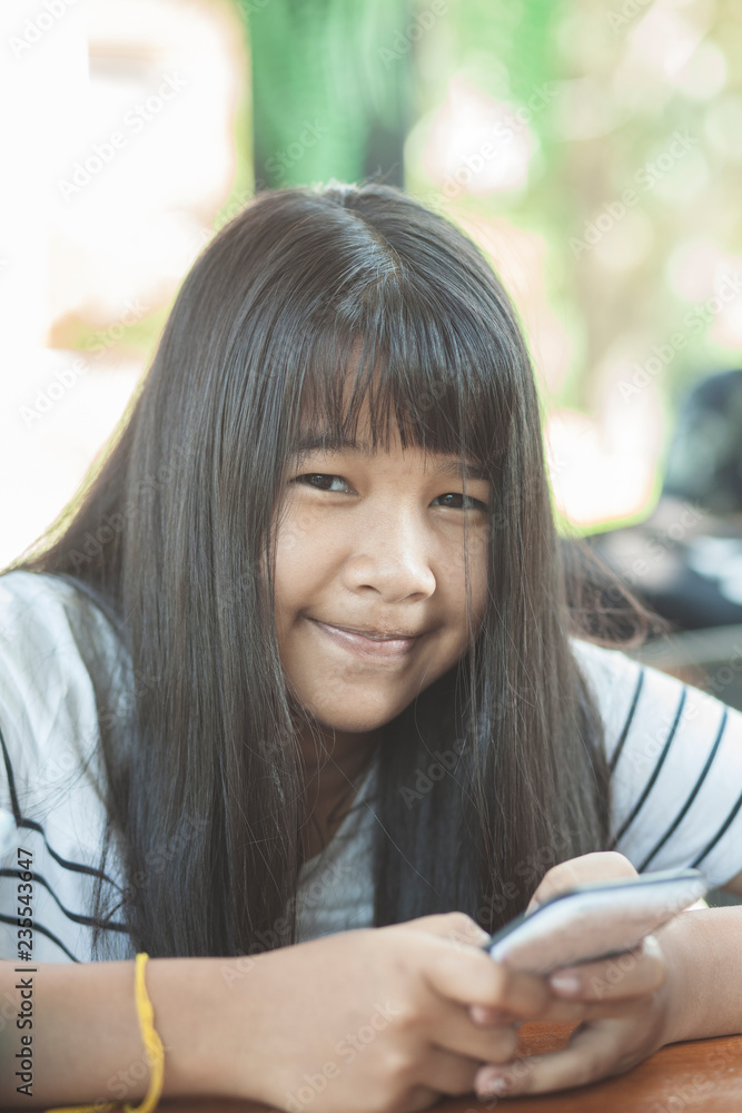 long hair asian teenager happiness emotion face chat social media on smart phone long hair asian teenager happiness emotion face chat social media on smart phone