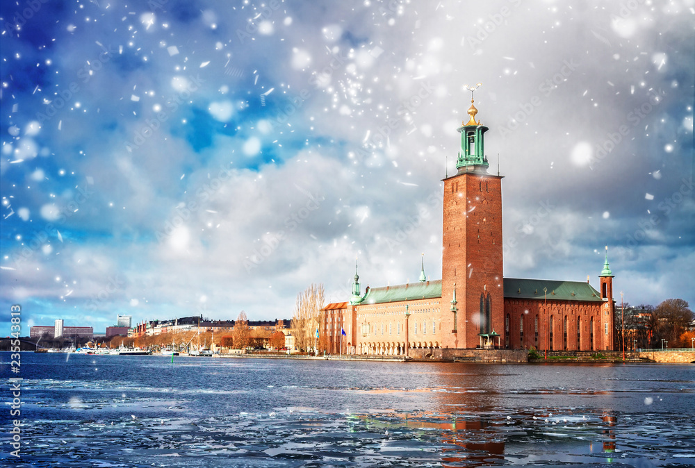 The City Hall Stadshuset in Stockholm with winter ice and snow, Sweden, toned