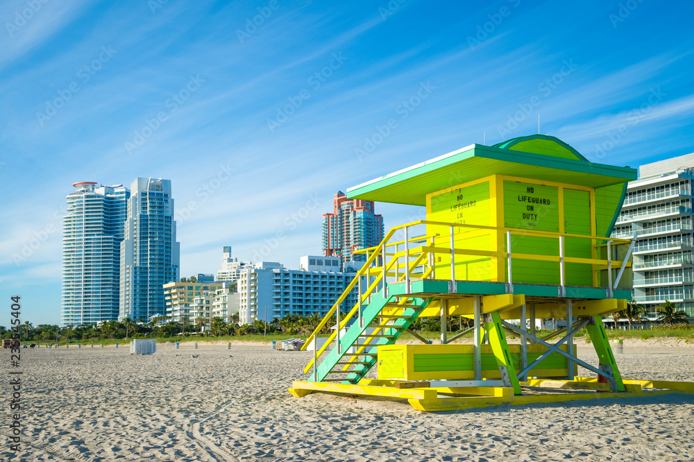 Brightly colored lifeguard tower standing empty in sunrise light on South Beach, Miami, Florida, USA Brightly colored lifeguard tower standing empty in sunrise light on South Beach, Miami, Florida, USA