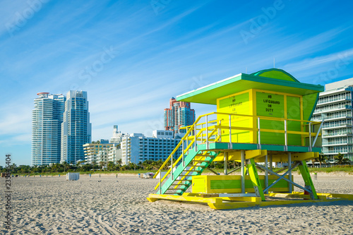 Brightly colored lifeguard tower standing empty in sunrise light on South Beach, Miami, Florida, USA © lazyllama