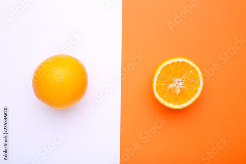 Ripe orange fruit on a colorful background
