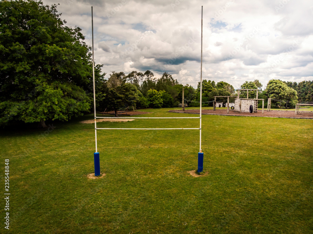 Obraz premium Drone view of goal posts in a rural school rugby field