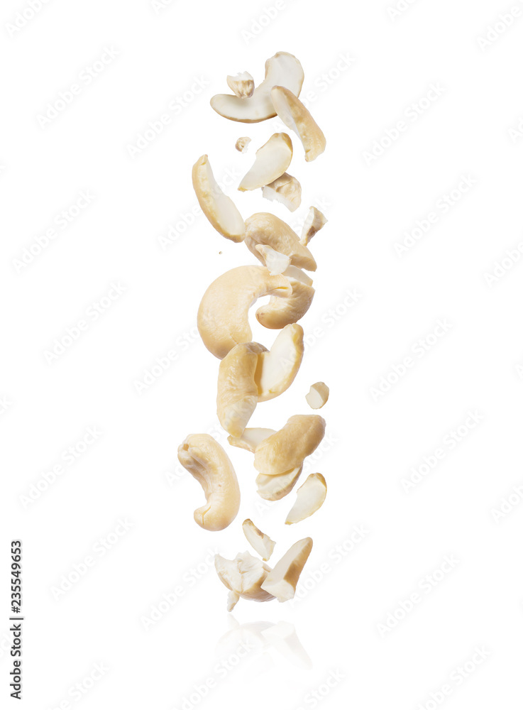 Cracked cashew fall down isolated on white background Cracked cashew fall down isolated on white background
