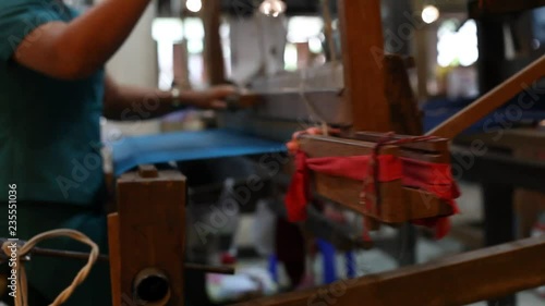 Wallpaper Mural Silk weaving, manual worker close up, textile production, manufacturing of fabric in Asia. Torontodigital.ca