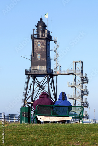 Erholung am Leuchtturm Obereversand in Dorum an der Nordseeküste bei Bremerhaven, Urlaub in Norddeutschland  photo