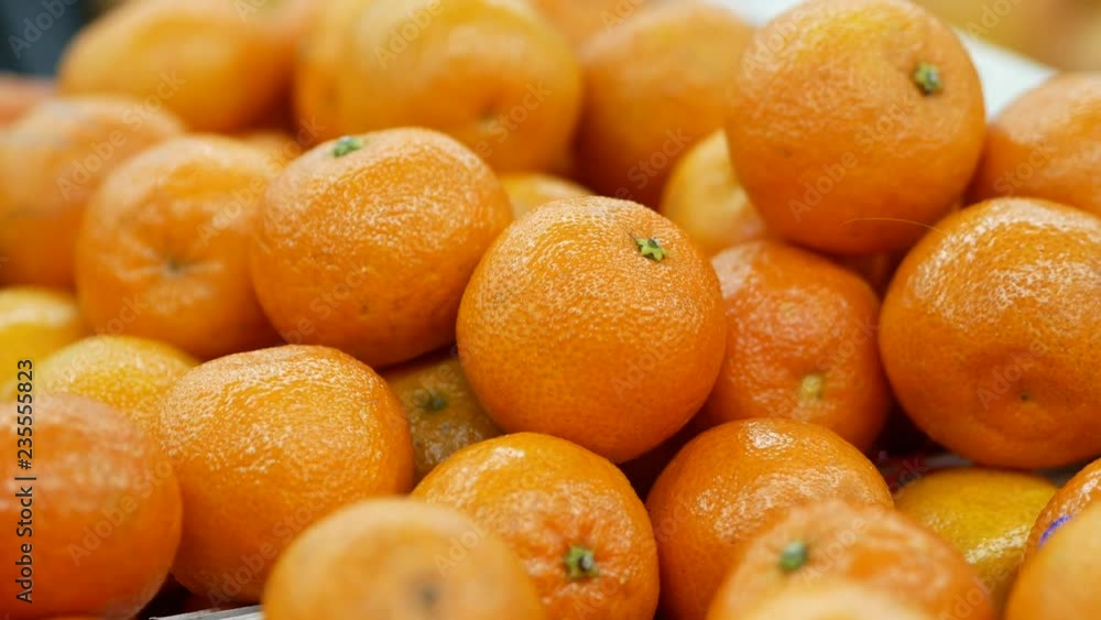 Harvest of mandarins on the store counter. Close up Harvest of mandarins on the store counter. Close up