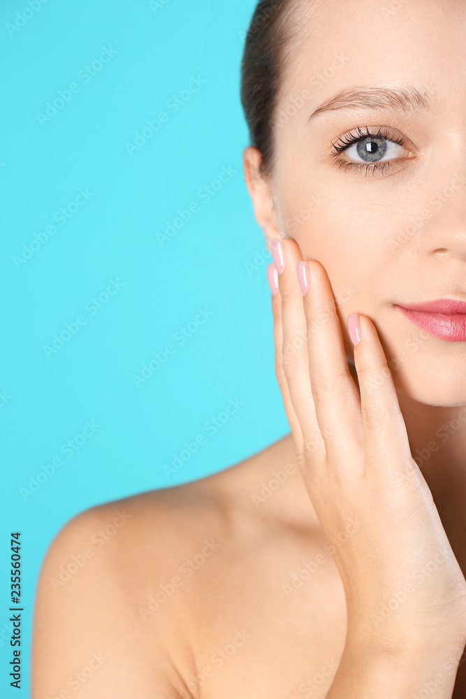Portrait of beautiful young woman and space for text on color background. Cosmetic surgery concept Portrait of beautiful young woman and space for text on color background. Cosmetic surgery concept