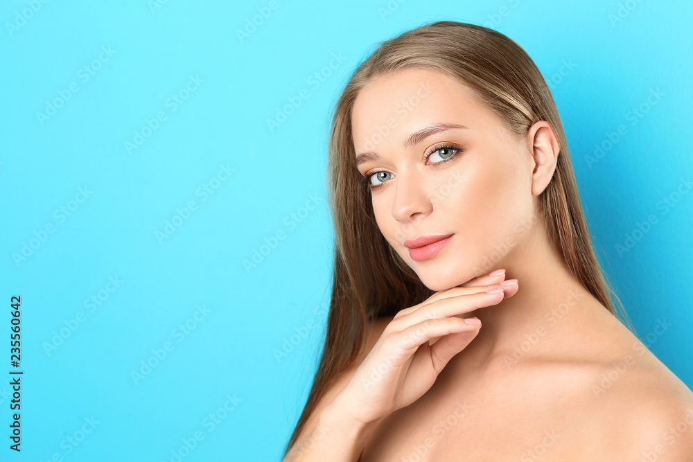 Portrait of beautiful young woman with natural makeup on color background. Space for text Portrait of beautiful young woman with natural makeup on color background. Space for text