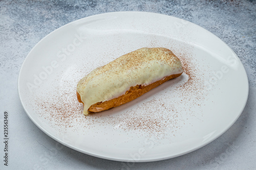 vanilla Eclair on a white plate