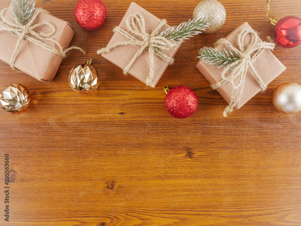 Flat lay,top view Christmas,new year ornaments and gift boxes on wooden background with copy space Flat lay,top view Christmas,new year ornaments and gift boxes on wooden background with copy space