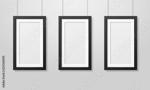 Three Vector Realistic Modern Interior Black Blank Wooden Poster Picture Frame Set Hanging on the Ropes on White Wall Mock-up. Empty Poster Frames Design Template for Mockup, Presentation