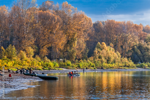 Fishermen on the river preparing for fishing. Suzun, Novosibirsk region, Western Siberia photo