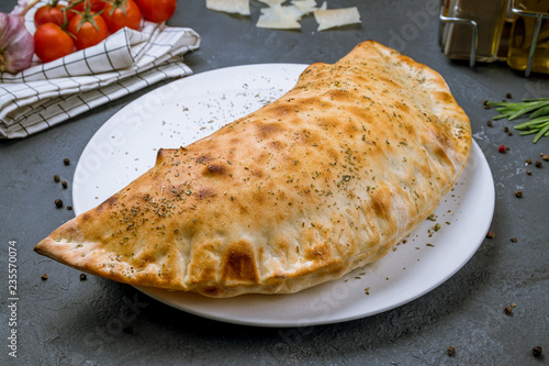 Closed calzone pizza photo