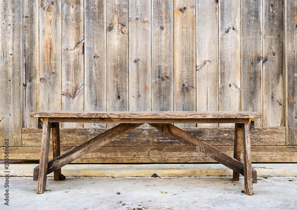 Fototapeta premium Wood bench against wood plank wall
