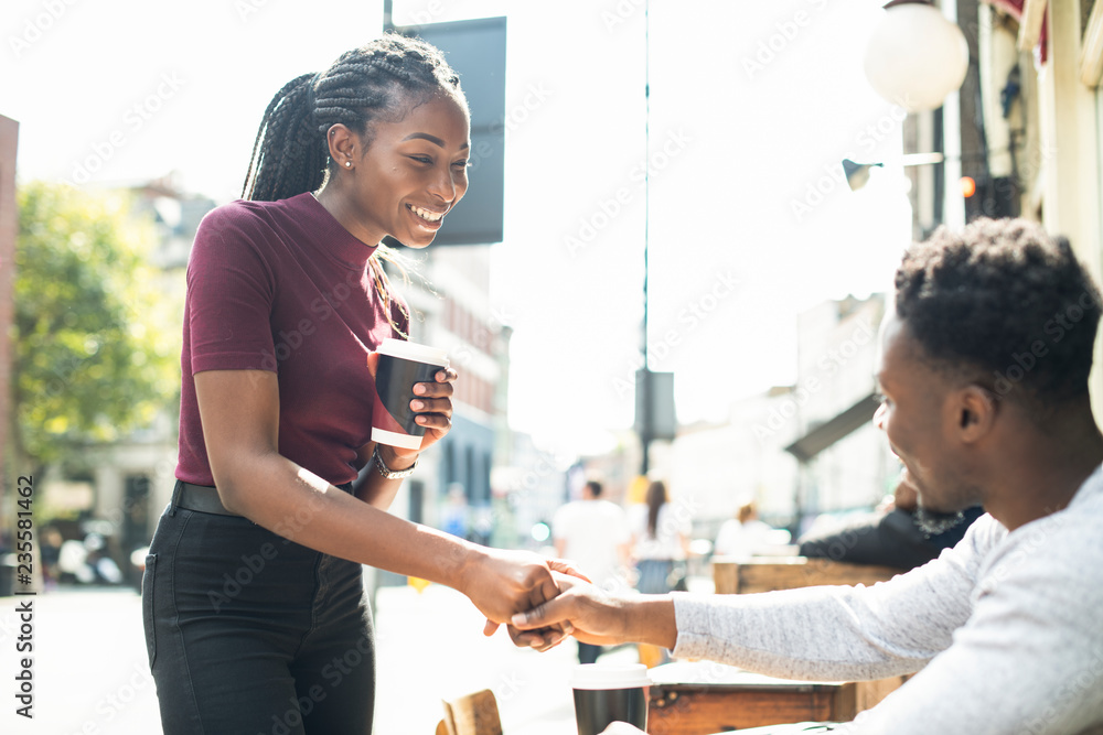 African couple shaking hands together African couple shaking hands together