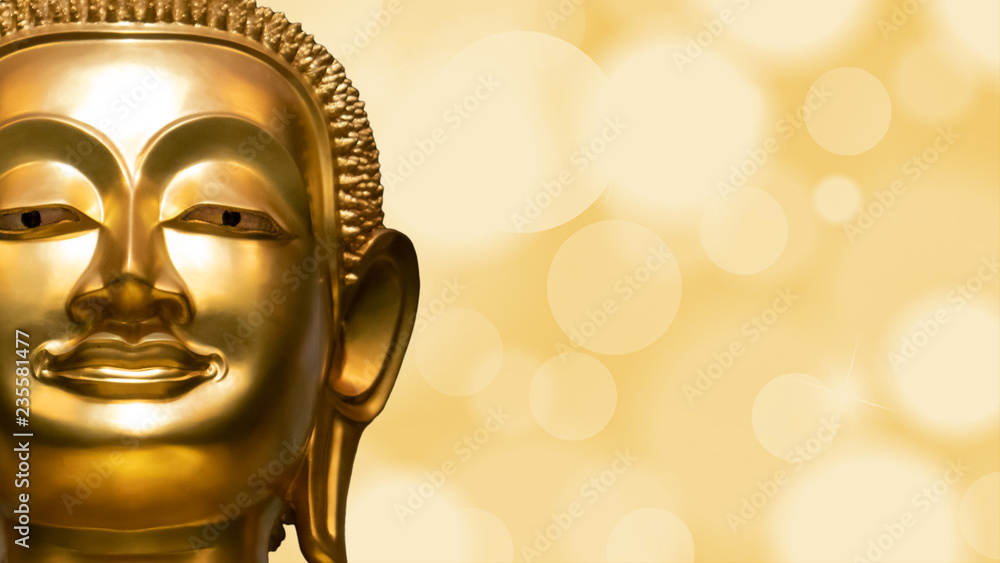 Fototapeta Golden Buddha face on golden abstract background