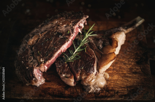 Tomahawk steak on a wooden board food photography recipe idea