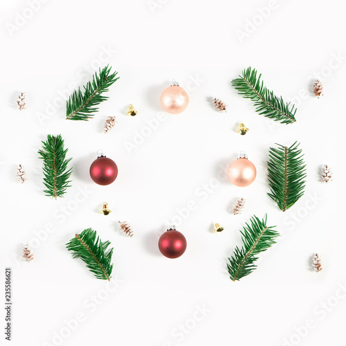 Festive composition of Christmas decorations on white background.