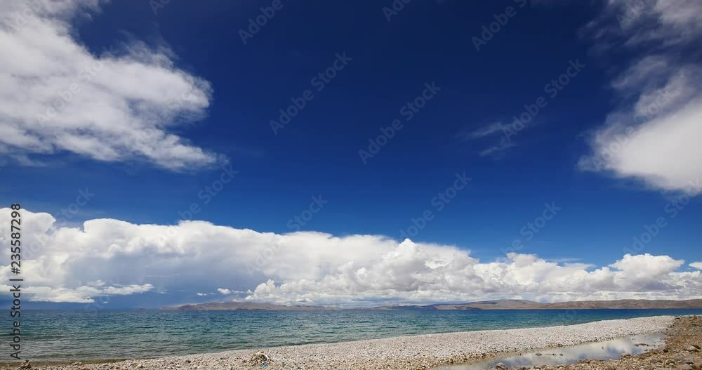 4k huge clouds mass rolling over lake namtso & Tanggula snow mountain peak,tibet mansarovar,Tibet's second largest lake,is the third largest saltwater lake in China. 4k huge clouds mass rolling over lake namtso & Tanggula snow mountain peak,tibet mansarovar,Tibet's second largest lake,is the third largest saltwater lake in China.