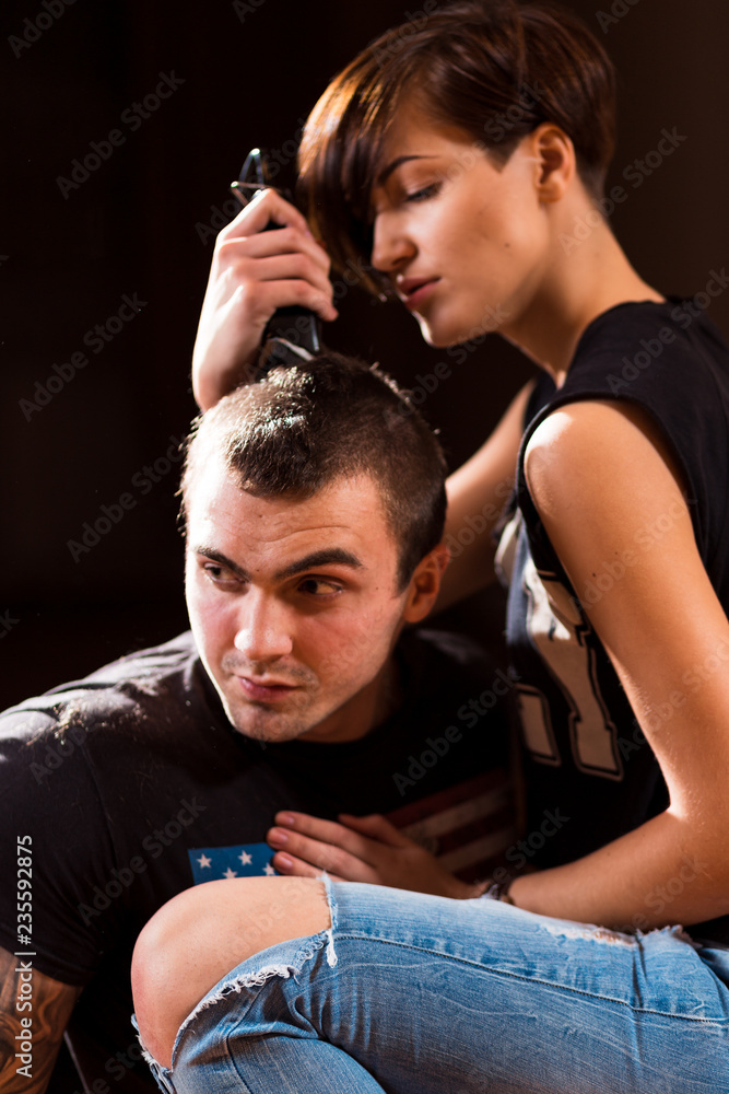 Young punk girl cuts her boyfriend Young punk girl cuts her boyfriend