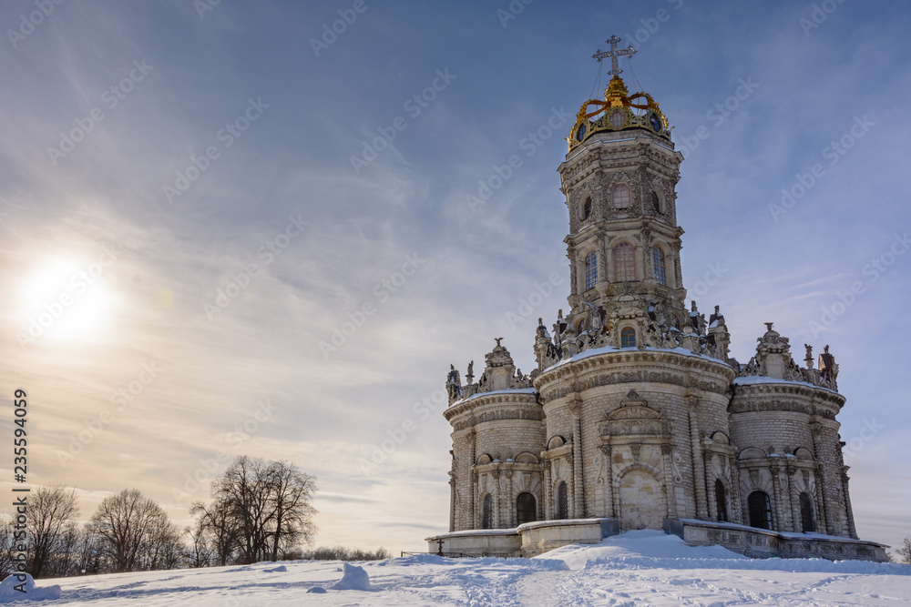 Sunny winter day. Winter landscape. Temple of Holy Virgin in Dubrovitsy in the Moscow region, Podolsk Russia