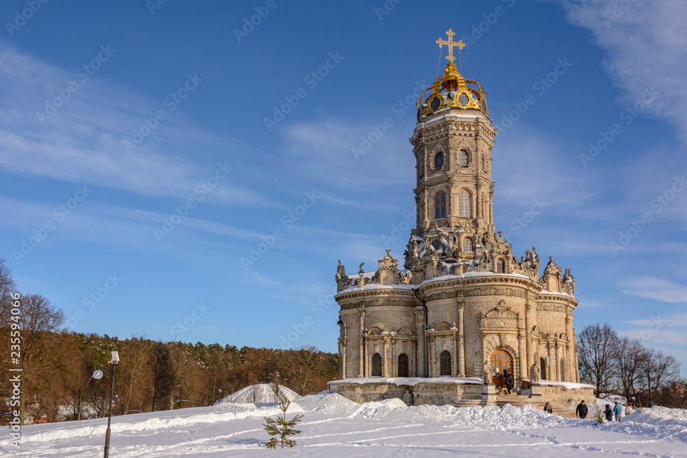 Sunny winter day. Winter landscape. Temple of Holy Virgin in Dubrovitsy in the Moscow region, Podolsk Russia