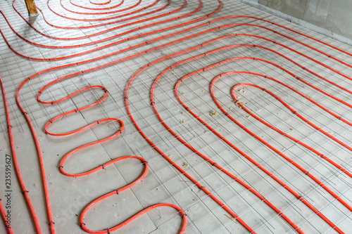 Tubes of the underfloor heating system on a styrofoam insulation