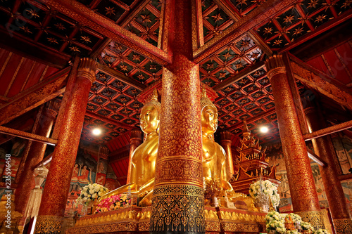Impressive Four-sided Seated Buddha Images with Gorgeous Lacquered Teak Wood Pillars in Wat Phumin Temple, Nan Province, Thailand 