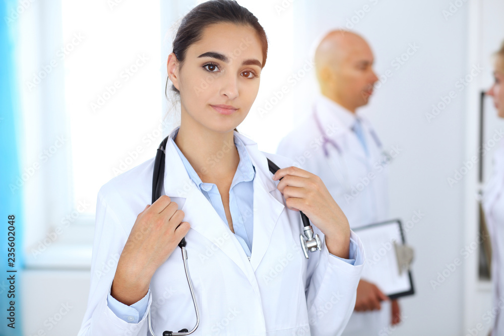 Portrait of young doctor woman in hospital. Hispanic or latin american staff in medicine Portrait of young doctor woman in hospital. Hispanic or latin american staff in medicine