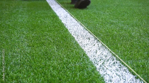 Marking football stadium field with paint