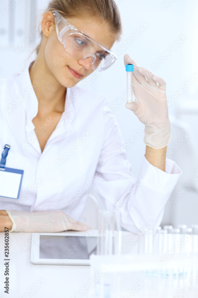 Female scientific researcher or blood test assistant in laboratory. Medicine concept Female scientific researcher or blood test assistant in laboratory. Medicine concept