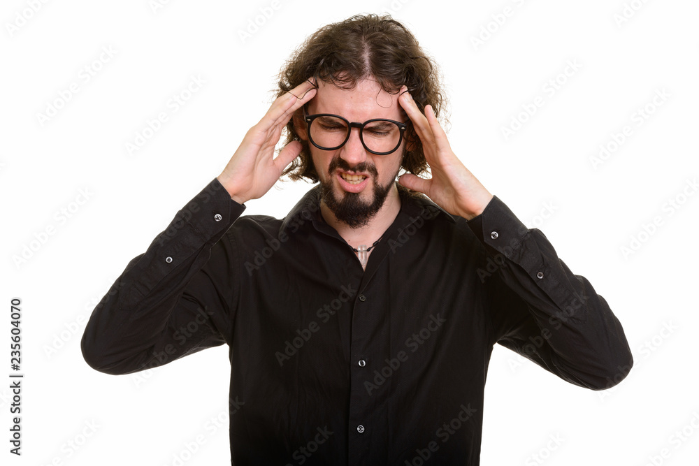 Portrait of stressed Caucasian bearded man having headache Portrait of stressed Caucasian bearded man having headache