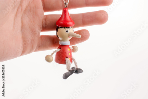 Pinocchio puppet in hand