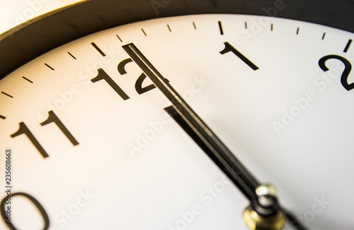 Close up of clock with selective focus at 12 o'clock
