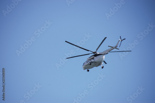 Helicopter flight in blue sky
