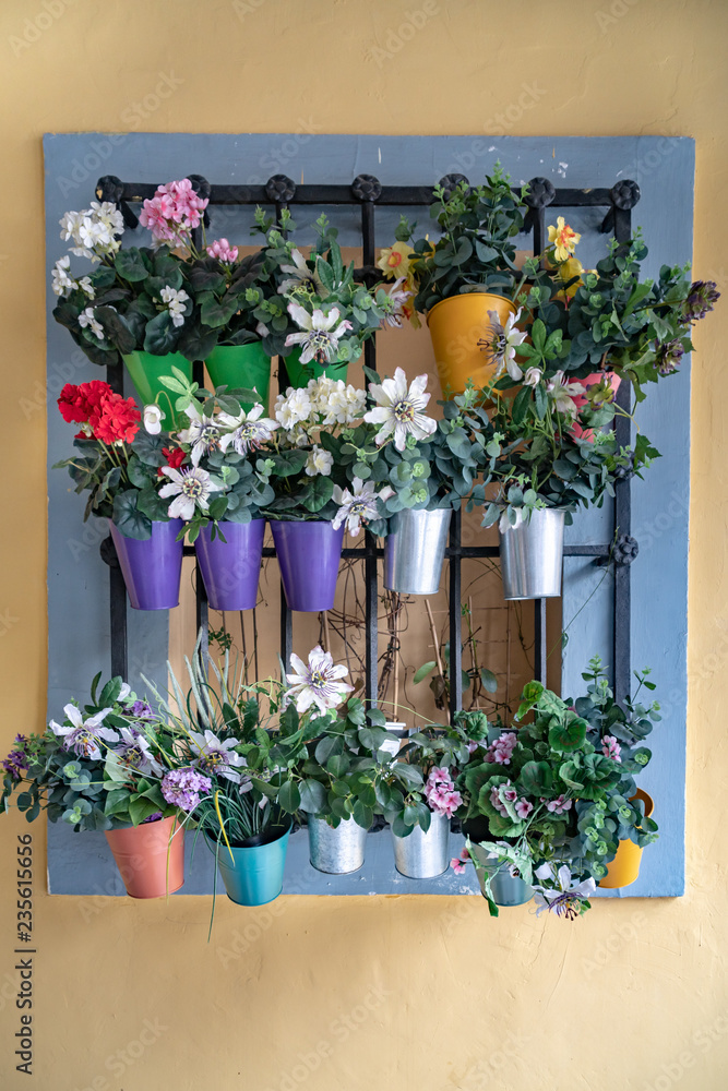 Flower Pot Display on Metal Bars on the Wall