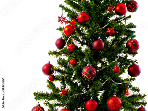 Big Christmas tree decorated with stars and beautiful red balls celebrate the festival.