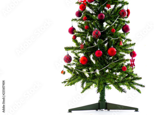Big Christmas tree decorated with stars and beautiful red balls celebrate the festival.