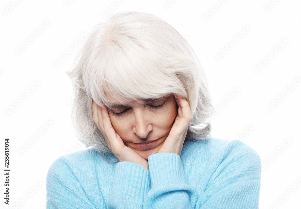 Lifestyle, health and people concept:A portrait of a senior lady having headache Lifestyle, health and people concept:A portrait of a senior lady having headache