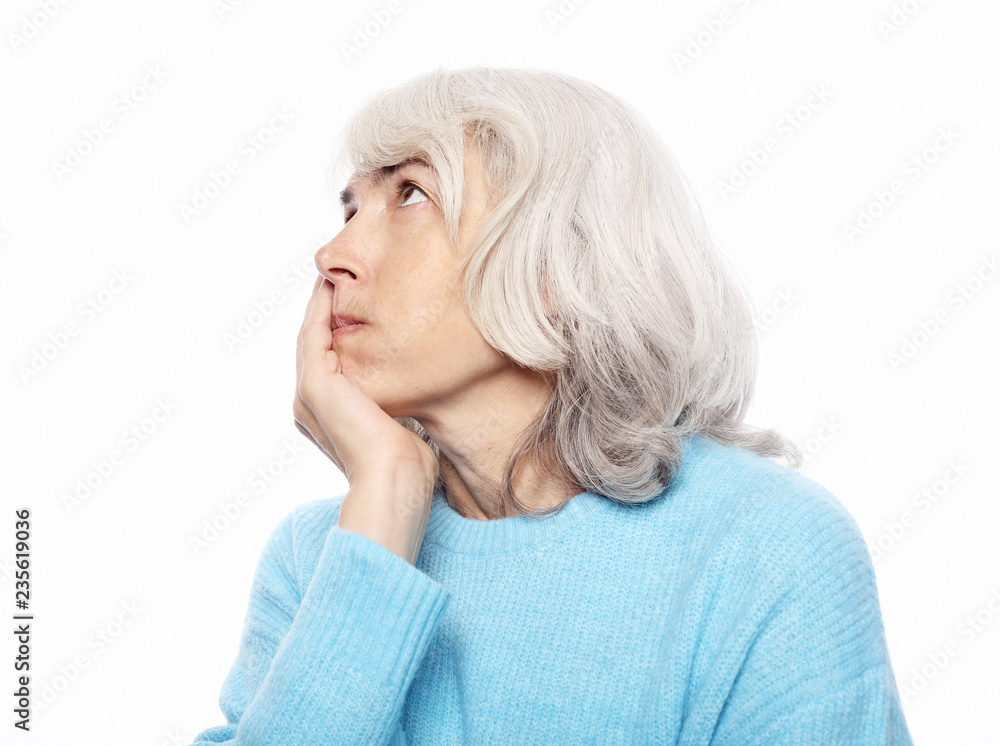 Lifestyle, health and people concept: Elderly woman suffering from toothache on white background Lifestyle, health and people concept: Elderly woman suffering from toothache on white background