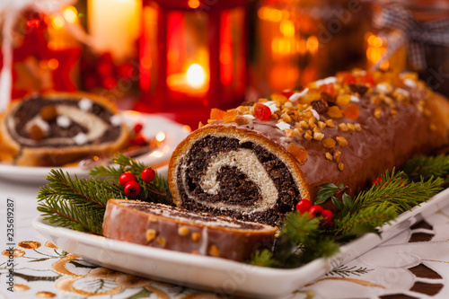 Poppy seed roulade in Christmas decoration. Served with coffee or tea.