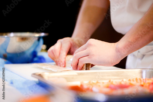 chef hands preparing japanese food, chef making sushi, Preparing Sushi roll